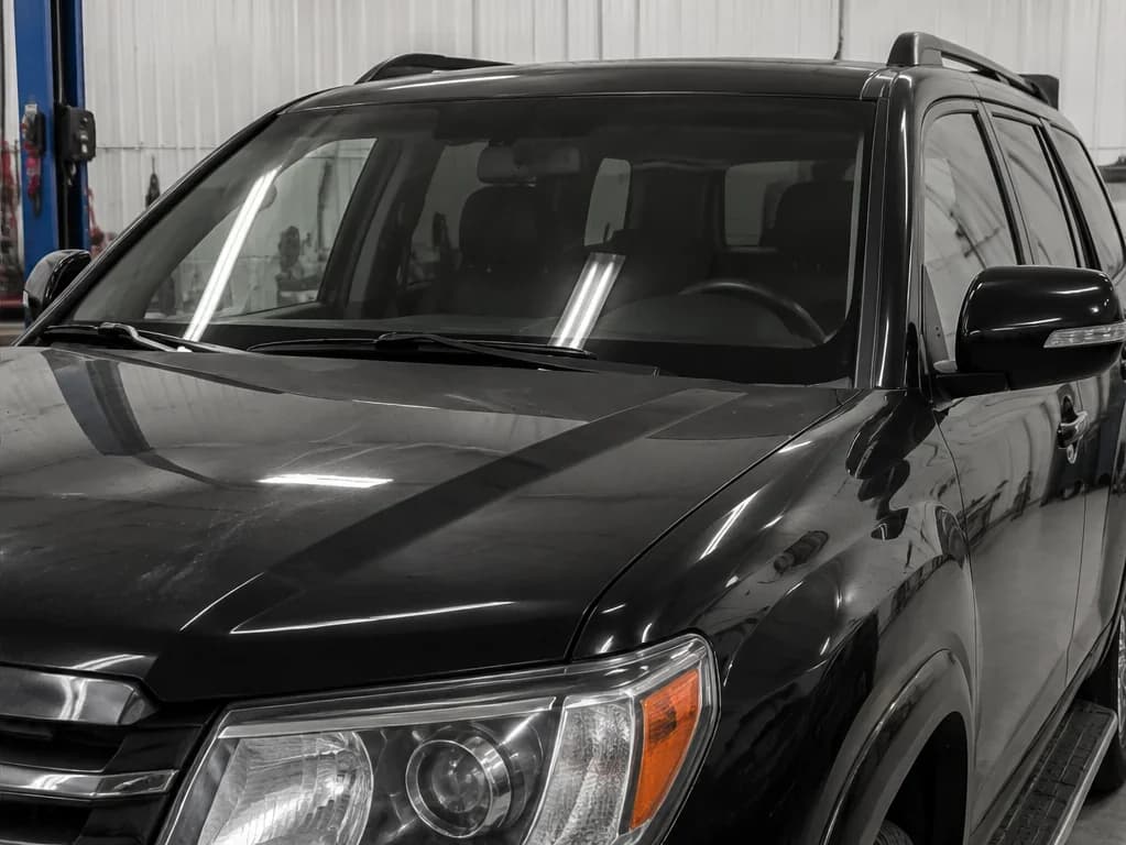After OEM-quality glass install, urethane seal, molding alignment, and ADAS calibration complete